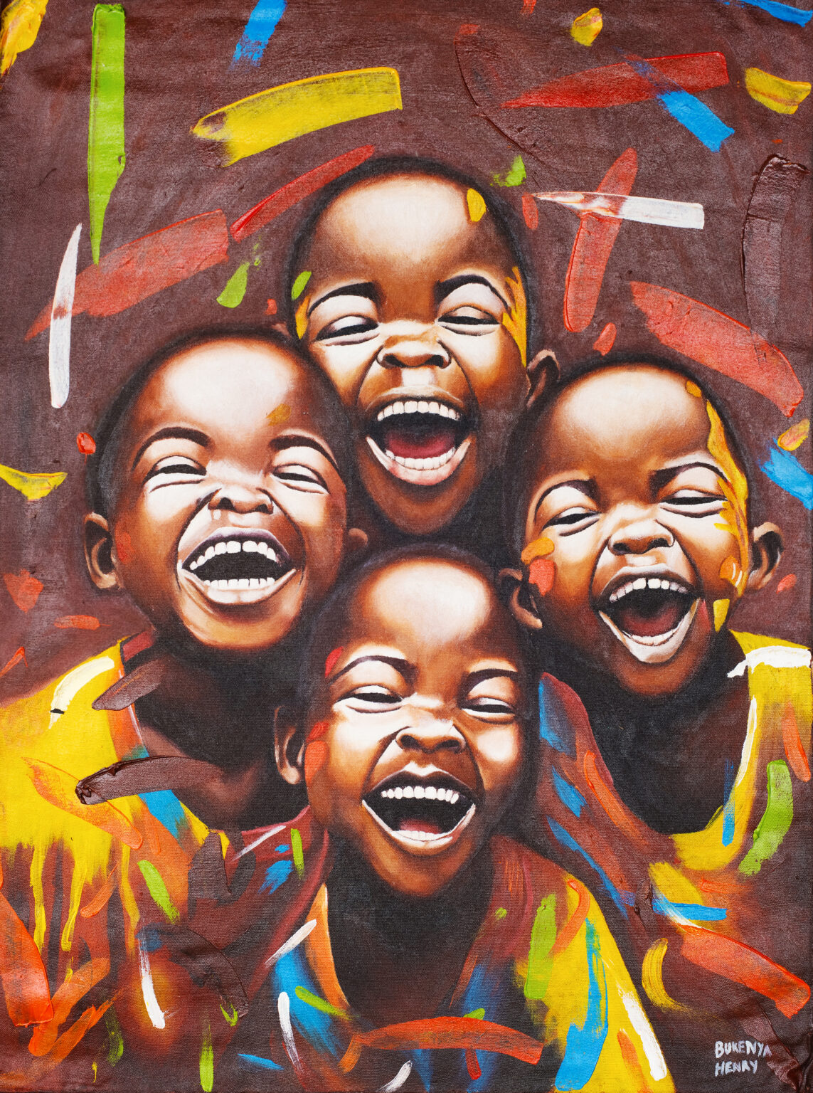 group of four young boys joyfully facing the viewer with open mouths smiling, brightly coloured